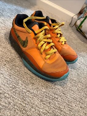 Nike Kids Orange and Yellow Low-Top Sneakers with Teal Outsole
